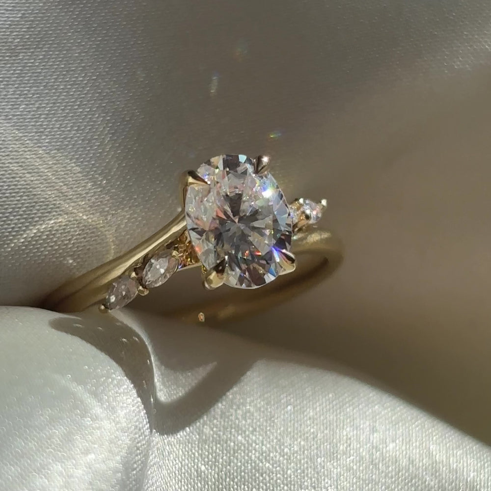 The Amira Ring™ - 1.5ct Moissanite Oval with Marquise Accents