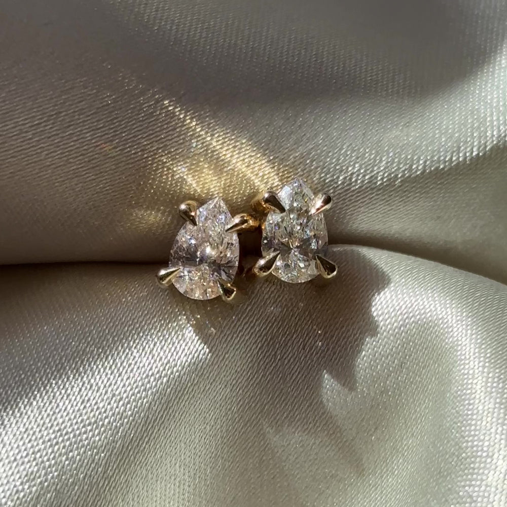 
                      
                        Load and play video in Gallery viewer, The Iris Earrings - 0.6CTTW Lab Diamond Pear Studs
                      
                    