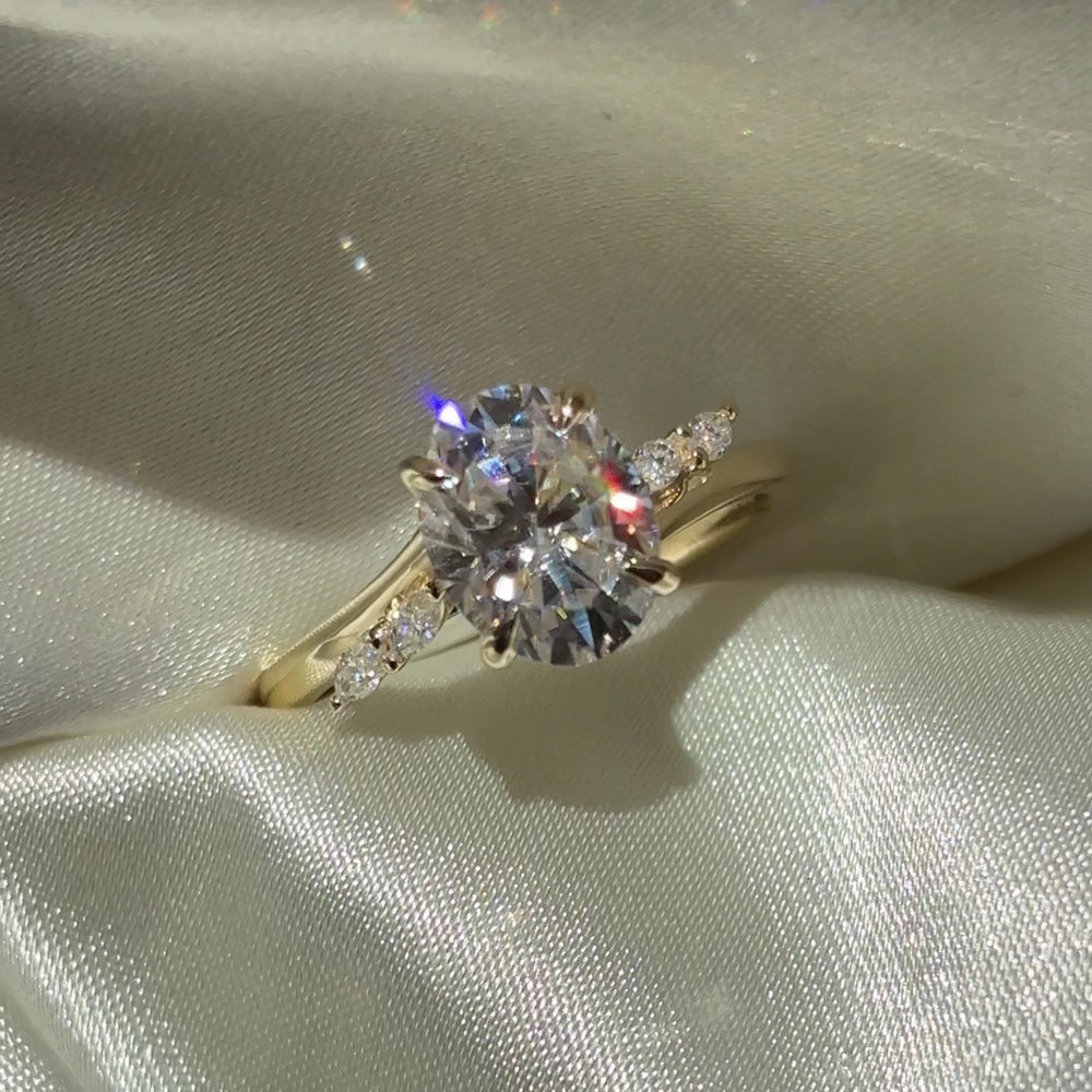 The Amira Ring™ - 2.1ct Moissanite Oval with Marquise Accents