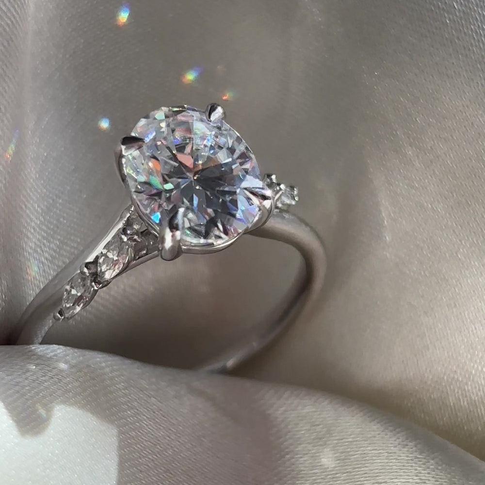 The Amira Ring™ - 2.1ct Moissanite Oval with Marquise Accents
